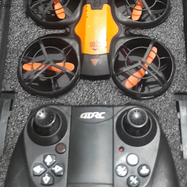4DRC V8 mini RC drone in black and orange color scheme with protective propeller guards