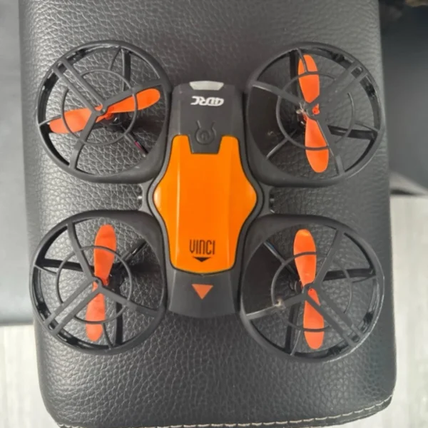 4DRC V8 mini RC drone in black and orange color scheme with protective propeller guards