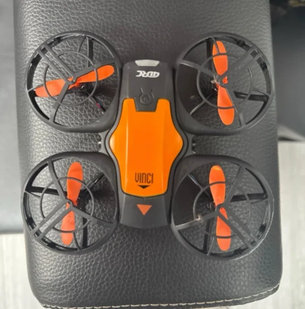 4DRC V8 mini RC drone in black and orange color scheme with protective propeller guards
